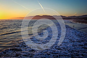 Beatiful susnet over Santa Monica beach with ocean waves