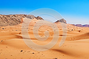 Beatiful view of sand dunes and rocky mountain