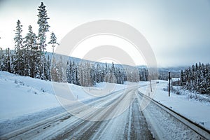 A beatiful winter scenery with a road. Woods in Norway.