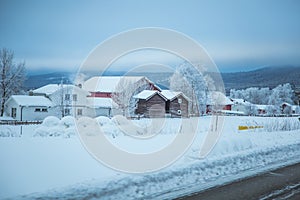 A beatiful winter scenery with a road. Woods in Norway.