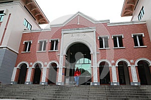 Beatiful woman walk from Library Building in Xiamen University