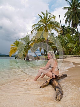 Beatiful young lady in a caribean beach