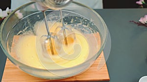 Beating the egg mass with a kitchen blender