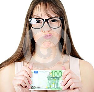 Beauitful woman holding some Euro currency note with funny look
