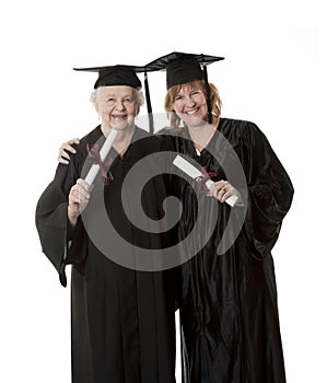 Beauitiful Caucasian mother and daughter in black graduation gowns