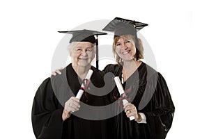 Beauitiful Caucasian mother and daughter in black graduation gowns