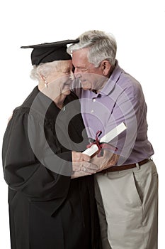 Beauitiful Caucasian woman in a black graduation gown