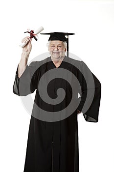 Beauitiful Caucasian woman in a black graduation gown with diploma