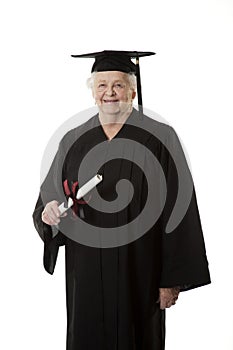 Beauitiful Caucasian woman in a black graduation gown with diploma