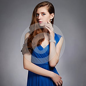 Beauitiful young woman in blue dress