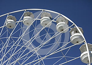 Beaumaris, Wales - the Ferris wheel against a blue sky.