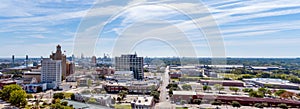 Aerial view of Beaumont Texas Cityscape with modern and historic buildings, Fuel refineries and the Port area