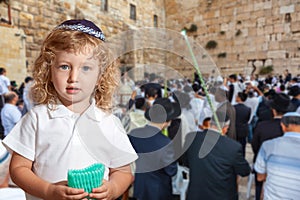 Beauteous little boy with blue eyes photo