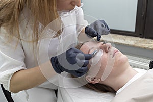 Beautician Applies Lash Lift Lotion On Rolled Hair During Eyelash Lamination Treatment