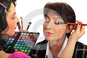 Beautician applying eyeshadow