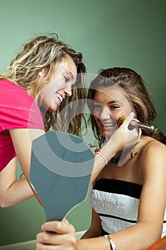 Beautician applying makeup