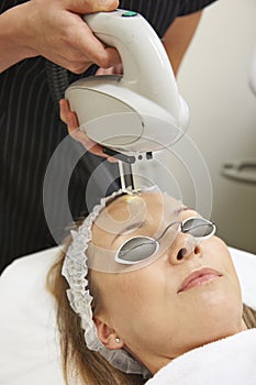 Beautician Carrying Out Intense Pulse Light Treatment