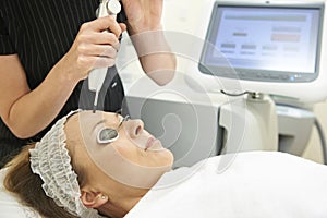 Beautician Carrying Out Q Switch Laser Treatment