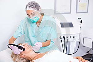 Beautician doing cryoliposuction