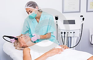 Beautician doing cryoliposuction