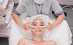 Beautician giving facial massage