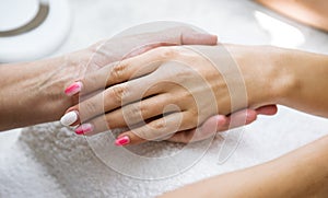 Beautician nail treatment.Beautiful hands of woman.
