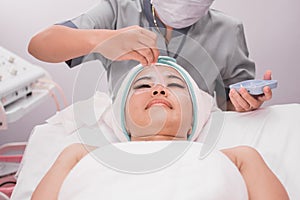 Beautician perform beauty treatment