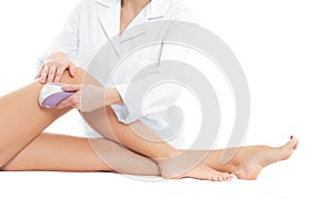 Beautician removing hair of woman`s leg. Laser epilation