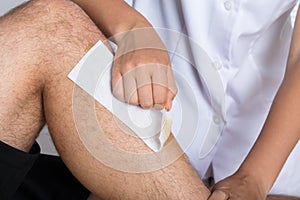 Beautician Waxing Man`s Leg