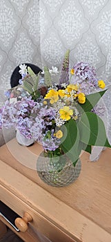 Beautidul Wildflowers arranged in a pot on the table