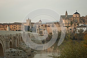 the beautiful Roman bridge over the river Guadalquivir leading to the town of Cordoba in Andalusia photo