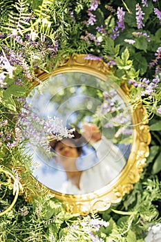 Beautifal mixed race woman wearing white dress and sky reflectio