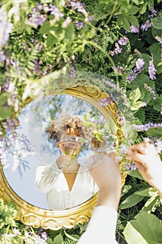 Beautifal mixed race woman wearing white dress and sky reflectio