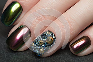 Beautifil Colorful manicure with rhinestone. Nail Design. Close-up photo