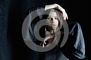 Beautifil woman in black dress with long sleeves