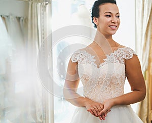 Beautifu bride choosing wedding dress in a wedding salon