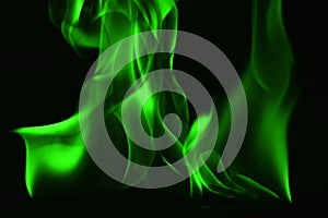 Beautifu green fire flames on a black background.