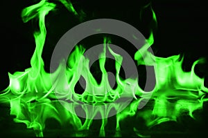 Beautifu green fire flames on a black background.