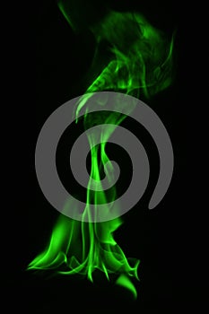 Beautifu green fire flames on a black background.
