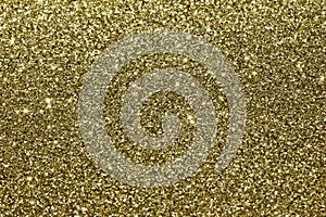 Beautiful abstract art texture background of gold color glitter