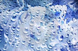 Beautiful abstract background with drops of water in blue tonality