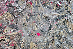 Beautiful abstract background made of aluminum foil with colored highlights