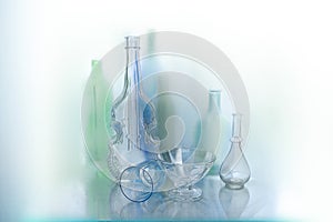 Beautiful abstract background made of glass objects .Abstract background of glass objects, bottles and vases