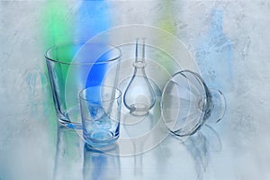Beautiful abstract background made of glass objects .Abstract background of glass objects, bottles and vases