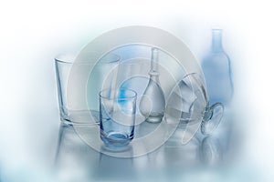 Beautiful abstract background made of glass objects .Abstract background of glass objects, bottles and vases