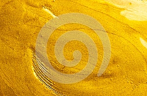 Beautiful abstract golden liquid paint background, beauty gold backdrop texture. Metallic gold paint, art design