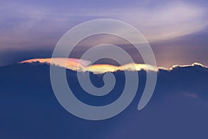 Beautiful abstract iridescence cloud irisation or rainbow cloud on sunset time.