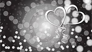 Beautiful abstract texture of white silver glittering love hearts on Happy Valentine`s Day in the background bokeh