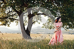 Beautiful Active Free Girl on Summer Green Outdoor Background