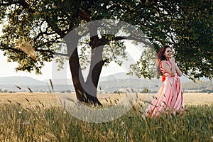 Beautiful Active Free Girl on Summer Green Outdoor Background